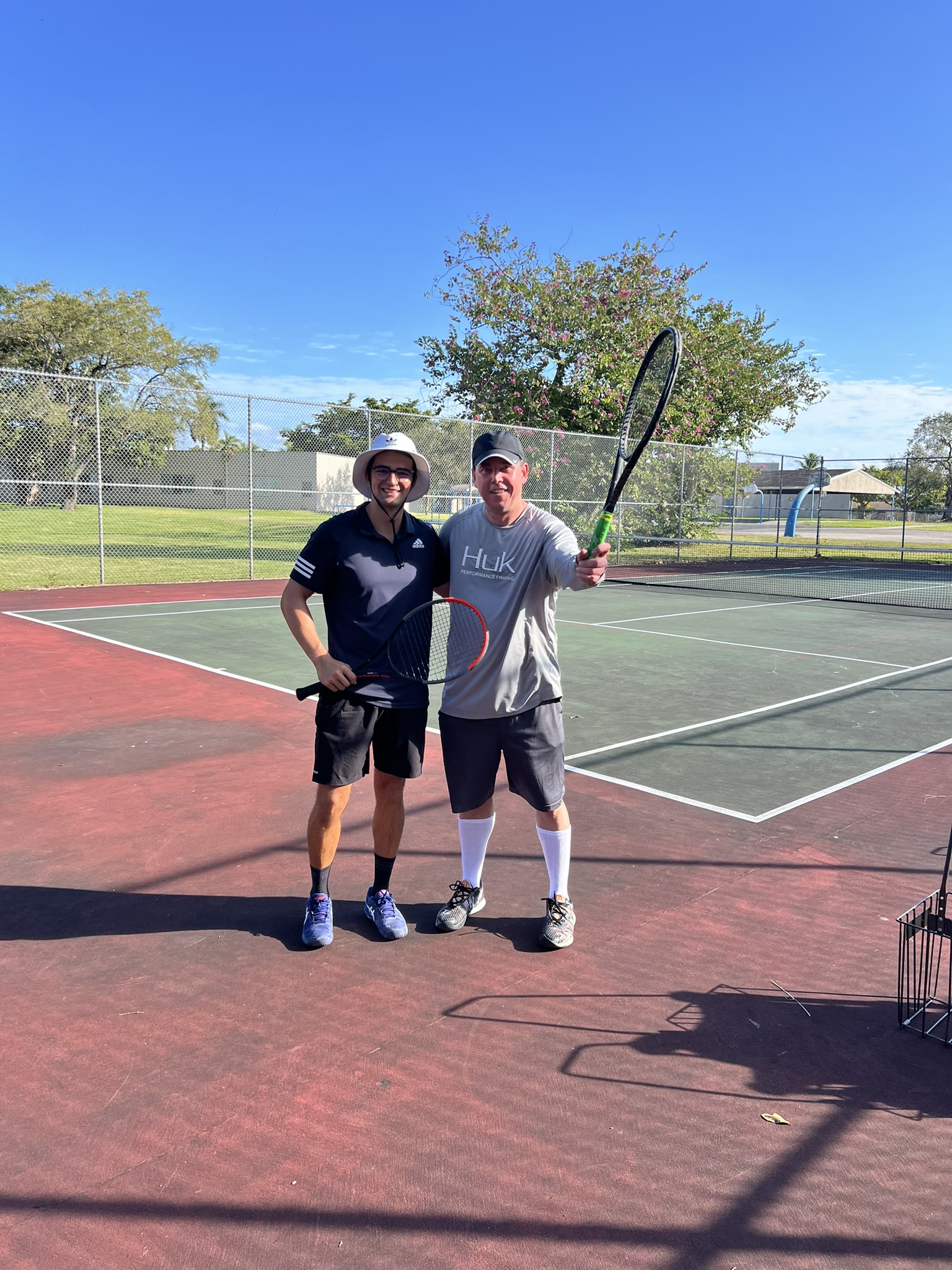 Andreu with an adult player after a session
